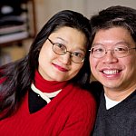 Close-up of a couple smiling at the camera.